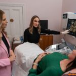 A woman at a gynaecological exam with two doctors